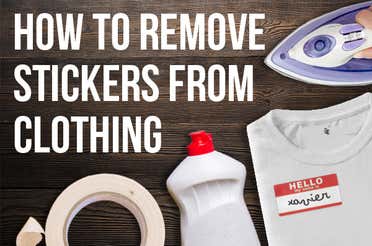 A white t-shirt with a sticker on it that has a bottle of dish soap and an iron right next to it.